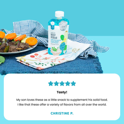 Baby food pouch beef kebab flavor on a table with a plate of food and a blue background with a customer review