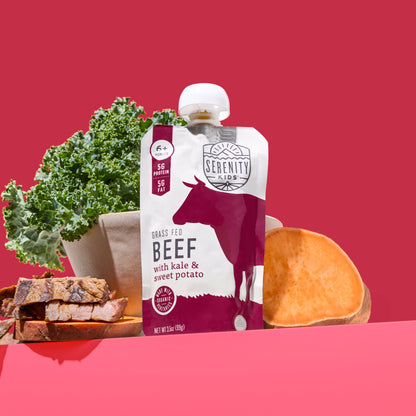Serenity Kids grass-fed beef pouch with kale, sweet potato, and beef on a red background
