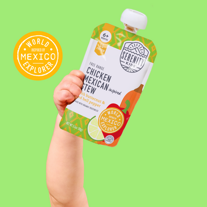 Hand holding a Serenity baby food pouch with a green background and 'World of Mexico Explored' logo.