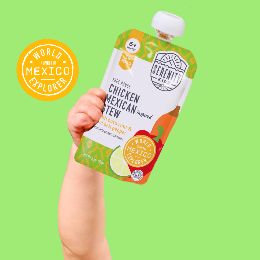 Hand holding a Serenity baby food pouch with a green background and 'World of Mexico Explored' logo.