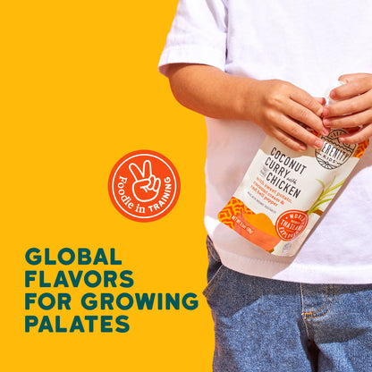 Child holding a Coconut Curry with Chicken baby food with text 'Global Flavors for Growing Palates' on a yellow background