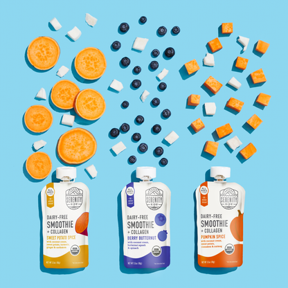Three packages of dairy-free smoothie with collagen on a blue background with scattered ingredients.