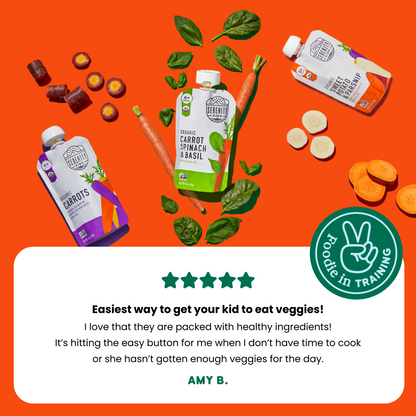 Product packaging with carrots, spinach, and basil on an orange background, featuring a 'Foodie in Training' badge and a customer review.
