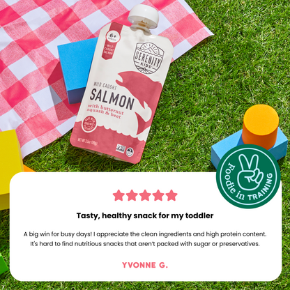 Salmon pouch on a checkered blanket with a peace sign icon and review text.