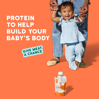 Child being held by an adult with a protein product packaging on an orange background