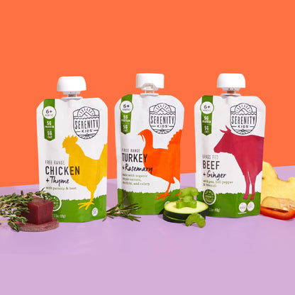 Three Serenity Kids food pouches on a colorful background