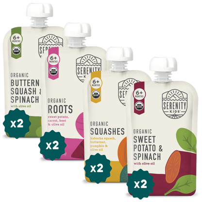 Four organic baby food pouches from Serenity Kids on a white background