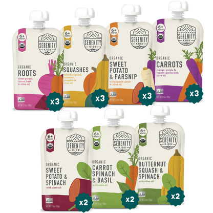 Assorted Serenity Kids organic baby food pouches on a white background