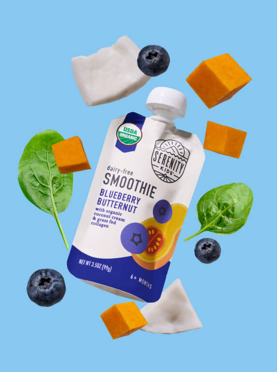 Serenity Kids Blueberry Butternut smoothie surrounded by blueberries, spinach and squash